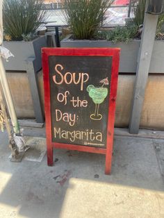 a sign advertising soup of the day margarita