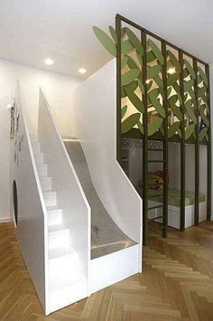 the stairs are made from white plywood and have green leaves on them as well