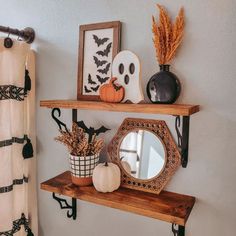 halloween decorations are displayed on shelves in the bathroom