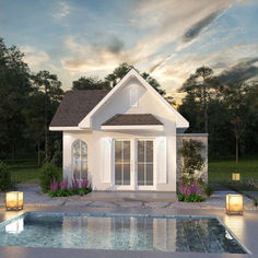 a house with a pool in front of it and some lights on the ground next to it