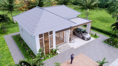 an aerial view of a house with a car parked in the driveway