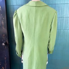 "Crazy unique vintage 60's/ 70's mod lime green/ chartreuse high low blazer jacket. Semi cropped in the front, duster length tail in back. Slightly puffed sleeve. Longer sleeve, looks great rolled once. 4 buttons in front with a secret black one being most important. Most likely polyester. Acetate feel lining. No tags! Definitely one of a kind. Will best fit women's medium. Good vintage condition, with signs of age and wear. Such a very rad piece. Im obsessed. Measurements laying flat: fabric do Tailored Green Outerwear For Spring, Green Fitted Long Coat, Retro Fitted Long Coat, Fitted Retro Long Coat, Retro Green Outerwear For Spring, Retro Green Spring Outerwear, Fitted Green Outerwear For Spring, Vintage Green Long Coat, Vintage Green Spring Outerwear