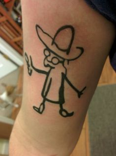 a person with a tattoo on their arm holding a knife and wearing a cowboy hat