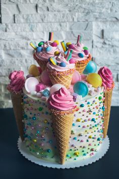 an ice cream cone decorated with sprinkles and candies