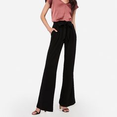 Original Retail Price: $79.90 Smooth And Sophisticated, These High Waisted Pants Are Perfect For The Office Thanks To A Paperbag Waist, Sleek Fabric And A Roomy Wide Leg. We Love Them Paired With A Portofino And Heels. Product Details - Size: Women’s Xs - Color: “Pitch Black” - Ultra Comfortable Fit - Wide Leg Style For Long Legs - Paperbag Style - High Rise - Elastic Waistband Makes Tucking In Any Top Easy! - New With Tags! - Inseam: ~32” **Check Out My Page For More Great Express Finds! ***Alw Elegant Wide Leg Pants For Summer Date Night, Elegant Summer Wide Leg Pants For Date Night, Versatile Wide Leg Pants For Spring Evening, Versatile Wide Leg Pants For Evening In Spring, Chic High-waisted Wide Leg Pants For Night Out, Black Wide Leg Pants With Pockets For Evening, Versatile Evening Wide Leg Pants For Spring, Chic Wide Leg Pants For Date Night, Evening Black Wide Leg Pants With Pockets