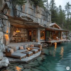 an outdoor living area next to the water