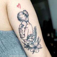 a woman's arm with a tattoo on it and a heart above her head