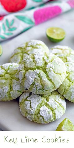 key lime cookies on a white plate with limes around them and the words key lime cookies