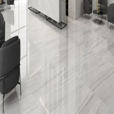 an office with marble floors and furniture