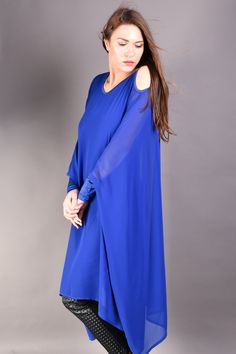 "Blue Loose Extravagant Tunic, Chiffon Tunic, Blue Tunic So dramatic and extravagant chiffon tunic in blue. The most standout features of this long sleeve tunic are the loose fit kimono cut and the cut out shoulders. It is definitely a must have for your wardrobe. If you are looking for something glamorous this chiffon top is the perfect addition to your party look matched with leather leggings and high heels. Material: Chiffon, Viscose ▲ Sizes: The item can be made in sizes from XXS to 5XL. Ple Blue Flowy Long Sleeve Chiffon Dress, Flowy Blue Chiffon Dress With Long Sleeves, Flowy Long Sleeve Blue Chiffon Dress, Blue Long Sleeve Georgette Dress, Long Sleeve Dresses With Sheer Sleeves In Georgette, Long Sleeve Georgette Dress With Sheer Sleeves, Chiffon Kaftan, Black Harem Pants, Maternity Tunic