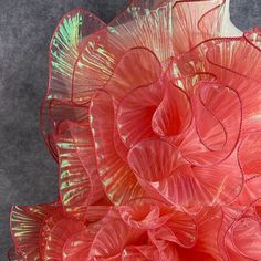 a large red flower on top of a table