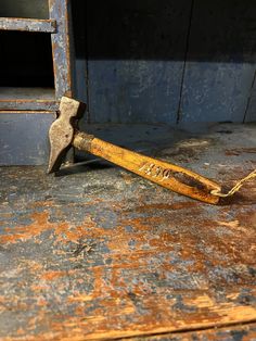 an old hammer is laying on the floor