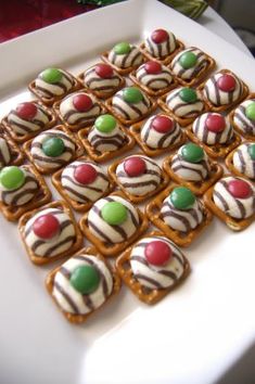 a white plate topped with cookies covered in candy