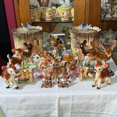 a group of deer figurines sitting on top of a table