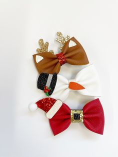 "These 4\" faux leather hair bows are the perfect accessory. Each bow is made from high quality printed faux leather material and attached to an alligator clip to stay secure in hair all day long. This is for one single bow, for a pigtail set you will need to buy two." Diy Christmas Hair Accessories, Christmas Hair Bows Diy, Cricut Bows, Faux Leather Hair Bows, Diy Leather Bows, Christmas Hair Clips, Leather Hair Bows, Faux Leather Bows, Holiday Hair Bows