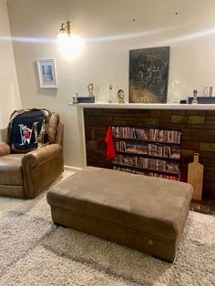 a living room filled with furniture and a fire place in the middle of the room