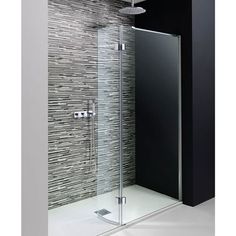 a glass shower door in a bathroom next to a wall with grey tiles on it