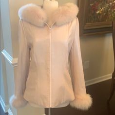 Beautiful Light Pearlized Pink Leather Jacket With Dyed Fox Around The Hood And Cuffs. Zip Front. Fully Lined . Two Front Pockets. Only Worn One Time. There Is A Small Scratch On The Leather Of The Inside Right Arm Next To The Fur Cuff. See Photo Please. Beautiful Stitching And Details. Other Than The Small Scratch This Coat Is In Excellent Condition. Fake Leather Jacket, Pink Leather Jacket, Swan Queen, Black Faux Leather Jacket, Cashmere Wrap, Suede Coat, Faux Leather Moto Jacket, Light Pink Color, Calvin Klein Women