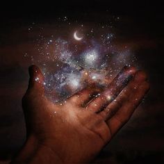 a person holding out their hand with stars and the moon in the sky above them