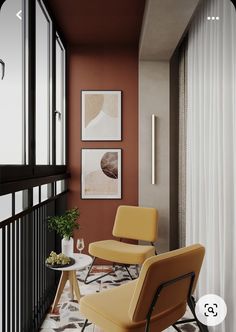 two yellow chairs sitting next to each other in front of a window