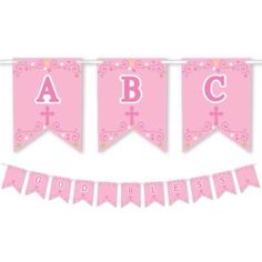 a pink banner with the letter abc and cross on it