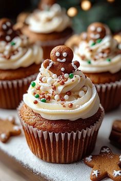 cupcakes with white frosting and sprinkles on top