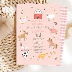 a pink birthday card with farm animals on it