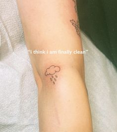 a person with a small tattoo on their arm that says, i think i am finally clean