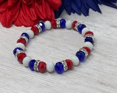 Bracelet measures approximately 7 inches. This bracelet only comes in stretch. Beads include: red, white, blue glass rondelle beads and silver plated rhinestone spacers Bracelet is handmade and new. Please see sizing details in shop FAQ.  Is this a gift? Don't know their bracelet length? The average bracelet length for teens is 6.5 inches.  The average bracelet length for women is 7.0 inches.  The average bracelet length for men is 7.5 inches. Follow my shop for discounts and promotions:  Instag Cheap Blue Patriotic Bracelets, Patriotic Round Beads Stretch Bracelet For 4th Of July, Patriotic White Stretch Bracelet With Round Beads, Patriotic White Stretch Bracelet, Patriotic Blue Stretch Bracelet For 4th Of July, Patriotic Multicolor Stretch Bracelet For 4th Of July, Patriotic Blue Beaded Stretch Bracelet, Blue Beaded Patriotic Stretch Bracelet, Patriotic Bracelet