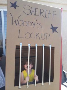 there is a cardboard sign that says sheriff woody's lockup