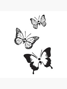 two butterflies flying in the air with one on its back and another on it's side