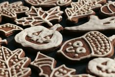 cookies decorated with icing and decorations on a table