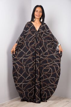 "Black Kaftan Maxi Dress for women Long boho oversized dress Summer caftan dress Loose fit plus size frock dress PRODUCT SIZE : One Size Fits Most * Chest: free up to 32 - 58\" * Waist: free up to 58\" * Hips: free up to 56\" * Length: 56-57\" from shoulder to hem, measured laying flat - when hanging it measures up to 58\" ) MATERIAL : * ITY Polyester Funky Elegant Collection --> Produced by NUICHAN & Co MODEL : * Model chest : 32\", waist : 24\" hips : 35\" * Combined Height is 5\"6 > I'm 5\"2 Black Bohemian Abaya For Beach, Chic Black Tunic Kaftan, Black Floor-length Kaftan For Summer, Oversized Printed Black Dresses, Black Printed Tunic Kaftan, Oversized Black Printed Dress, Oversized Black Kaftan For Beach Cover-up, Bohemian Black Floor-length Kaftan, Summer Caftan