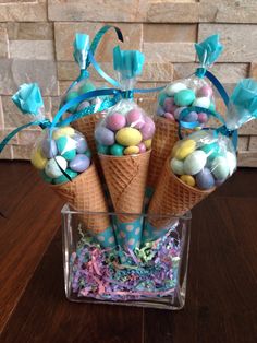 some ice cream cones filled with candy and candies