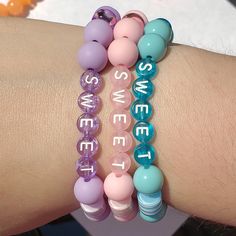 Add a sweet accent to your outfit with this adorably vibrant wrist candy. Stretchy letter bracelet with pink gumball beads & iridescent shapes Kandi Bracelets, Wrist Candy, Letter Bracelet, Your Outfit, Bead Crafts, Coco, Beaded Bracelets, Candy, Bracelet