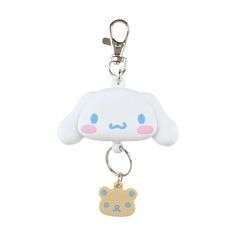 a keychain with a cartoon character on it's front and back ends