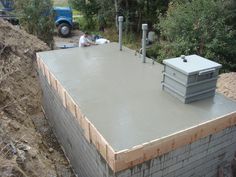 a man laying on top of a building under construction