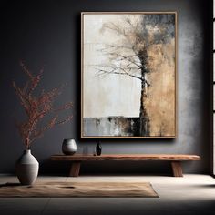 a painting hanging on the wall above a wooden table with vases next to it