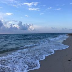 the ocean waves are coming in to the beach