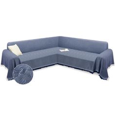 a blue sectional couch with two pillows and a pillow on the bottom right hand corner