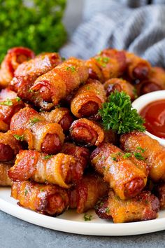 bacon wrapped little smokies on a plate with ketchup