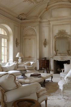 an elegant living room with white furniture and large windows in the wall to the ceiling