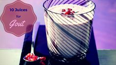 a glass filled with pudding sitting on top of a black plate next to a spoon