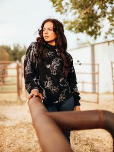 Get the best of the wild west with the Le Rodeo Sweater. Featuring a western print and rodeo-inspired design, this sweater offers an oversized look for added comfort. Perfect for any stylish cowgirl, this sweater is a must-have for any wardrobe. Western Tops For Rodeo In Fall, Western Style Tops For Rodeo In Fall, Western Style Crew Neck Tops For Fall, Relaxed Fit Top For Western-themed Fall Events, Casual Fall Tops For Ranch, Relaxed Fit Tops For Western-themed Fall Events, Long Sleeve Top For Ranch In Fall, Long Sleeve Tops For Western-themed Fall Events, Black Long Sleeve Tops For Western-themed Events