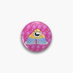 a pink button with an image of a cartoon character wearing blue jeans and a yellow hat