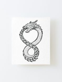 a black and white drawing of a snake on a square canvas mounted to a wall