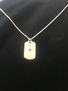 "Minimalist Heart Embossed Sterling Silver Ingot Necklace, marked .925 purity, 16\" Sterling Chain, designed & carved by artist Malcolm Davies and Made in England.Brand new, unused, new condition" Valentine's Day Silver Etched Necklace, Sterling Silver Etched Dog Tag Necklace, Sterling Silver Etched Dog Tag Jewelry, Etched Sterling Silver Dog Tag Jewelry, Silver Etched Necklace For Valentine's Day, Sterling Silver Engraved Dog Tag Necklace, Engraved Sterling Silver Dog Tag Necklace, Sterling Silver Stamped Necklace With Rectangular Pendant, Silver Oblong Necklaces For Gifts