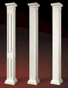 three white pillars are lined up against each other on a red floor with black background