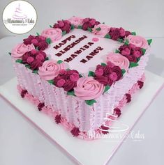 a birthday cake decorated with pink and purple flowers