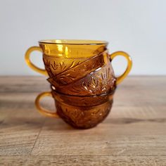 3 Vintage Amber yellow glass cups with floral design. Retro Kitchen. Depression glass replacements. 3.5'' wide, 2 1/4'' tall. Excellent condition.  Save on shipping when you buy multiple items from my shop! Amber Kitchen, Kitchen Decor Vintage, Amber Glassware, Glass Coffee Mug, Tinted Glass, Glass Coffee Mugs, Glass Cups, Vintage Kitchen Decor, Glass Replacement